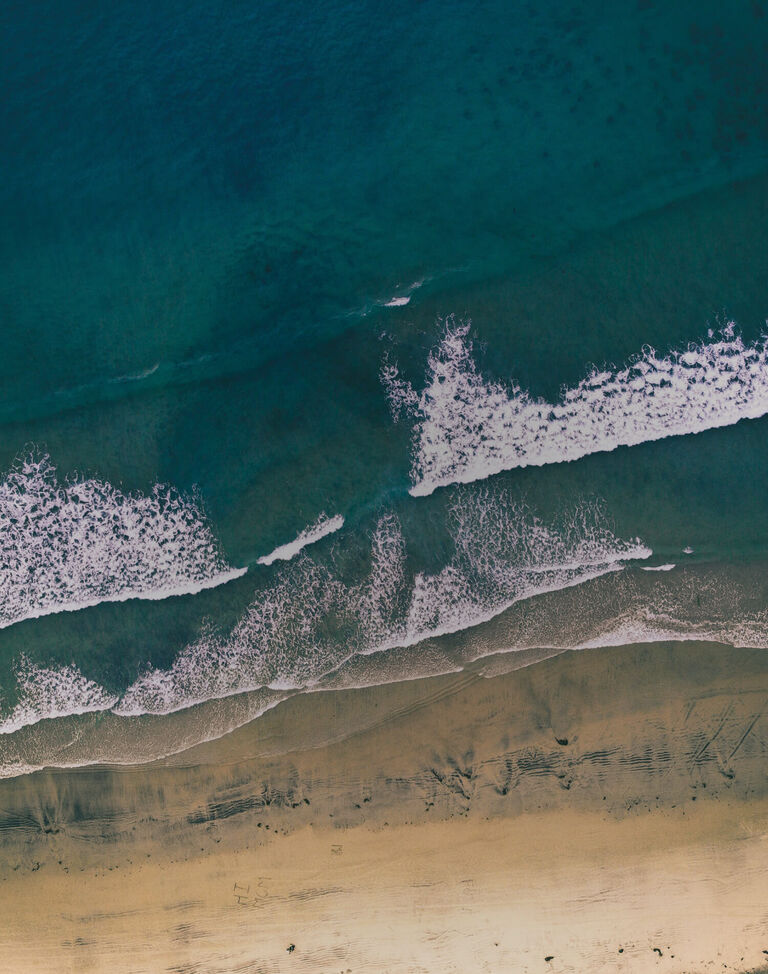 A top down view of beach waves.