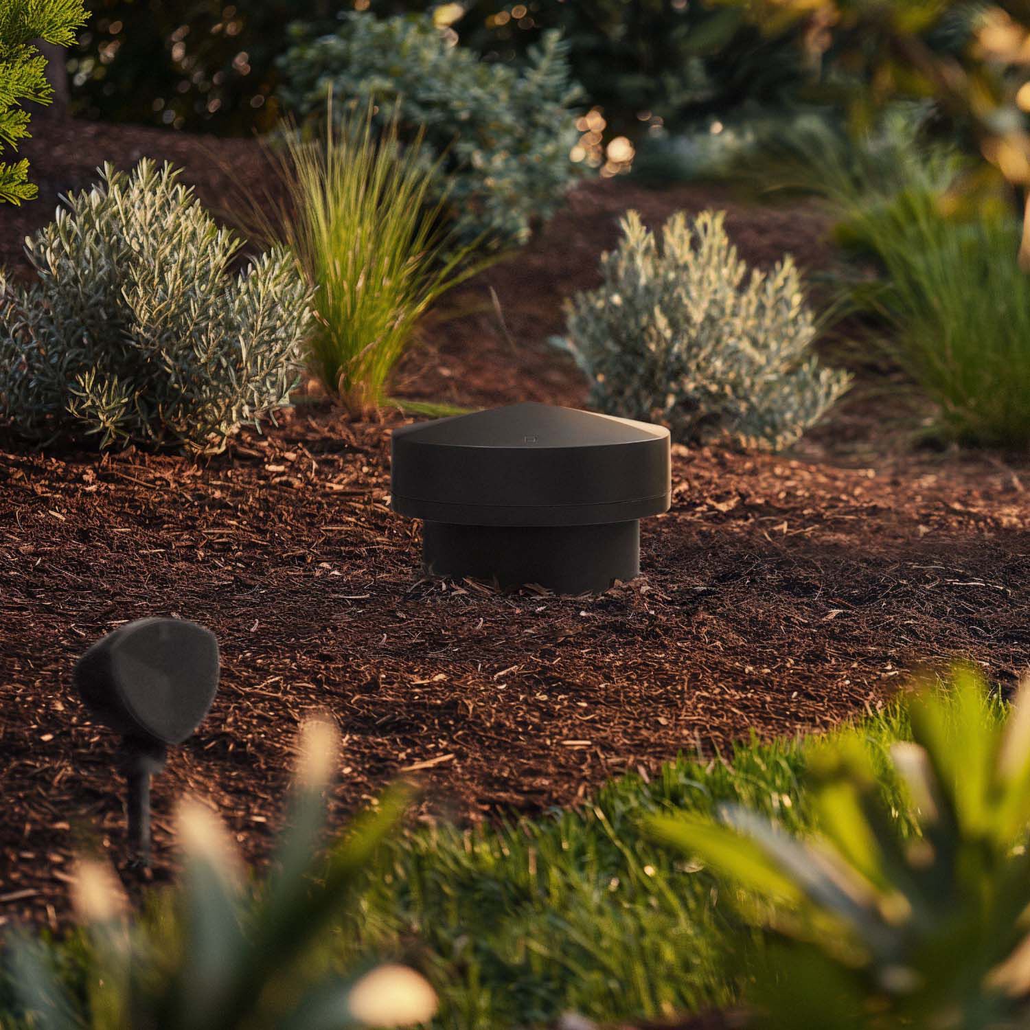 LS-80 Sub and LS-400 speakers in a garden bed